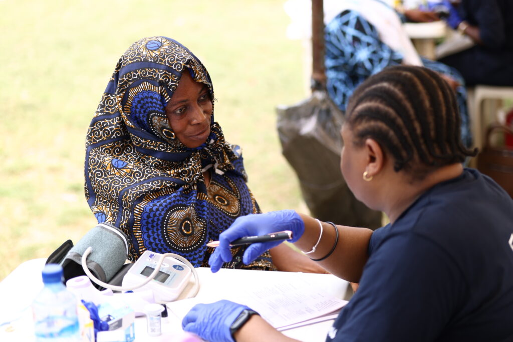 Volunteers caring for patients at a Mercy Said No medical mission